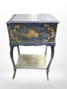 A 19th century French painted work table on cabriole legs,