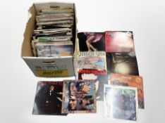 A box of assorted vinyl records,