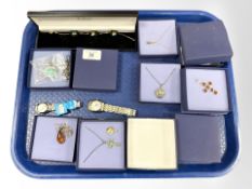 A collection of silver/costume jewellery including various pendants, a bracelet,