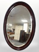 A late Victorian oval mirror,