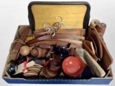 A box of 20th century Danish teak items including coat hangers, napkin rings, coasters,