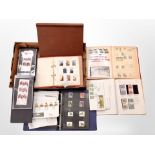 A box of stamp albums and first day covers