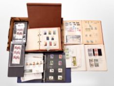 A box of stamp albums and first day covers