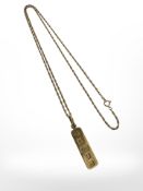 A 9ct gold ingot pendant on chain, pendant 38mm long including loop.