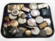 A large quantity of assorted compacts and scent bottles.