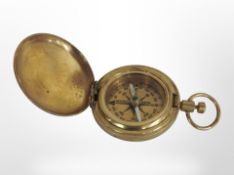 A brass pocket compass marked 'Ross London'.