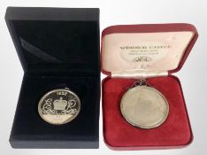 Two silver-mounted coins, 'Windsor Castle' and the 'Queen's Jubilee 1977'.