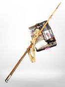 A vintage two piece fishing rod and a box of fishing equipment,