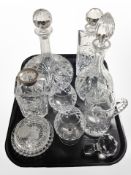 A crystal decanter with silver collar, together with several other examples, ship's decanter,