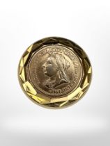 A Victorian half sovereign encased in a circular gold pendant mount, diameter 23mm.