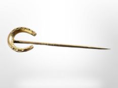 A 15ct gold horseshoe stick pin CONDITION REPORT: 2.