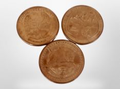 Three American copper coins.