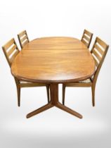 A 20th century teak extending dining table,