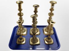 Two pairs of brass candlesticks and two other examples, tallest 30cm.