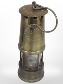 An Eccles Protector Type 6 brass miner's lamp.