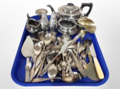 A quantity of silver plated cutlery, tea service, candlestick,