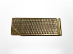 An Alfred Dunhill & Sons silver gilt money clip, London 1985.