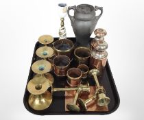 A group of 19th-century copper and brass measures, together with a set of four brass candlesticks,