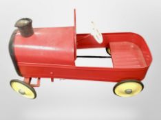 A child's vintage tin plate pedal car,