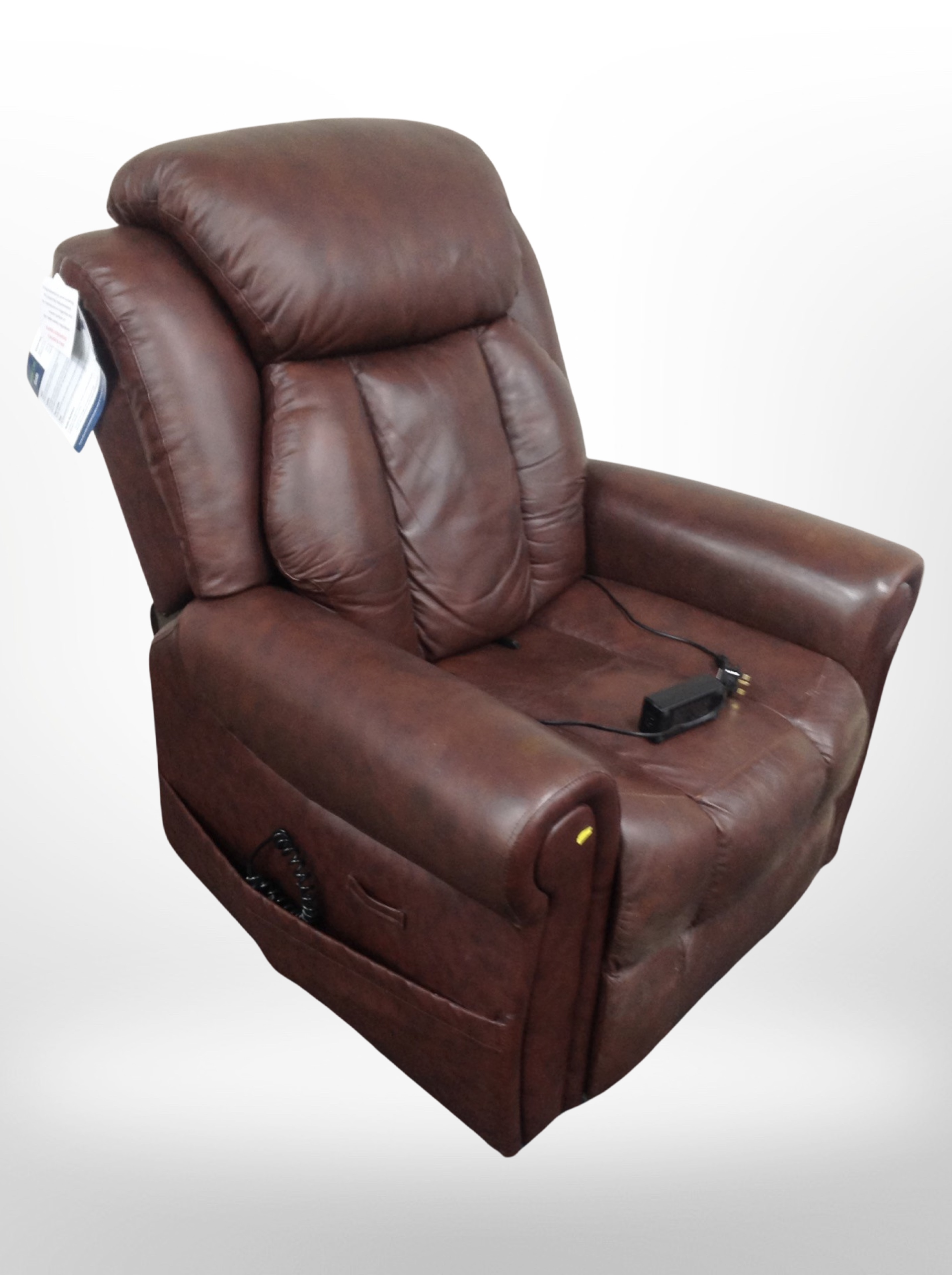 A contemporary leather mobility assist electric armchair