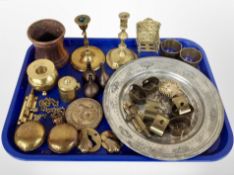 A group of brass and copper wares, candlesticks, beaker, napkin rings,