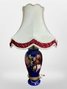 A Moorcroft table lamp with shade, overall height 65cm.