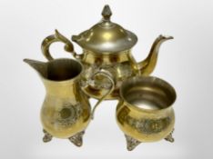 A brass three-piece tea set, height 16cm.