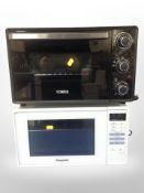 Two tabletop ovens, a Panasonic microwave and an air fryer.