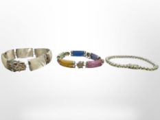 Three decorative silver bracelets