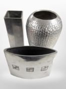 Two contemporary polished aluminium vases with inlaid decoration, and a further vase, tallest 25cm.