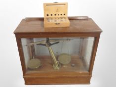 A set of chemist's scales in display box and a set of micro weights