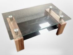 A contemporary glass and wood effect coffee table,