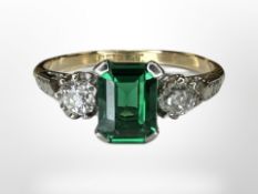 An antique 18ct gold and synthetic emerald three stone ring,