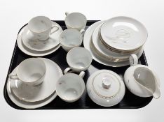 Twenty-one pieces of KPM tea china.