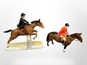A Beswick figure of a lady riding side saddle jumping over a fence,