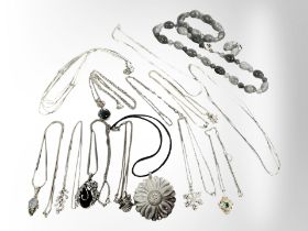 A group of silver jewellery comprising of a polished stone necklace, bracelet and earrings set,