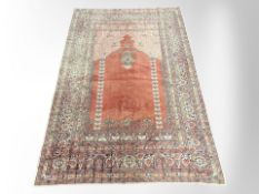 An Eastern throw in the style of an Anatolian prayer rug,