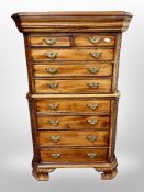 A reproduction mahogany miniature chest on chest in the George III style,