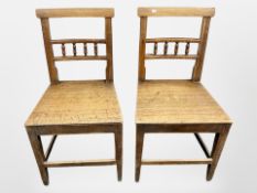 A pair of Edwardian oak dining chairs