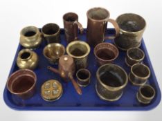 A group of brass and copper wares, tankards,