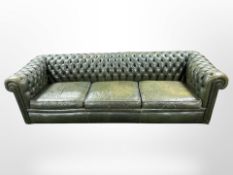 A Chesterfield green button leather club settee,