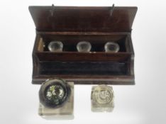 A 19th-century oak desk stand with three inkwells, together with two further crystal inkwells.