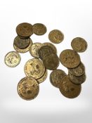 A small group of Victorian gambling tokens and other coins.