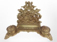 An ornate brass desk standish,