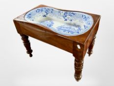 A Victorian mahogany commode stool with inset blue and white transfer printed bowl,