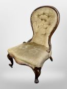 A Victorian carved walnut lady's chair