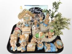 A collection of Pendelfin rabbit ornaments and stands