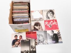 A box of assorted vinyl records,