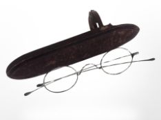 A pair of antique spectacles in case.