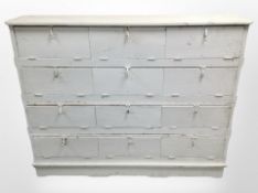 A Victorian painted pine bank of twelve pigeon hole shelves,